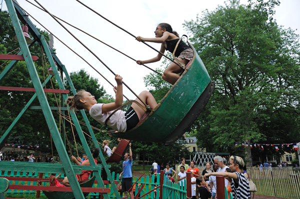 Vintage carousels transform Governors Island park 4 Boat swings at Fete Paradiso on Governors Island. (Photo: Terese Loeb Kreuzer)