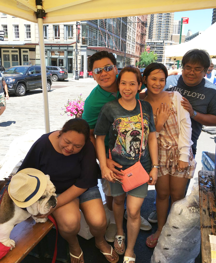 Seaport Report: July 2016 5 Photo by Janel Bladow This family came all the way from the Philippines to the “Strut, Swagger and Slobber Bully Beach Party” to meet host James Goubeaux’s bulldog Oliver.