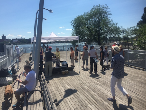 First Tentative Steps to Open Up East 90th Pier 2 Upper East Side residents enjoy “Summer Sizzle,” sponsored by the Friends of the East River Esplanade, on August 7. | JACKSON CHEN