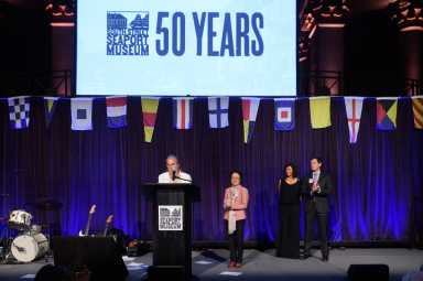 Borough President Gale Brewer, at podium, spoke at the 50th-anniversary gala to benefit South Street Seaport Museum at Ciprini Wall Street, joined by, from left, Councilwoman Margaret Chin, SSSM benefactor Anita Durst, and SSSM Executive Director Capt. Jonathan Boulware.
