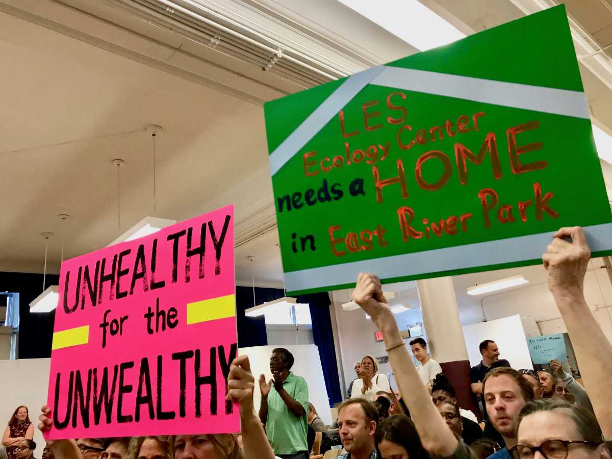 signs held up during meeting