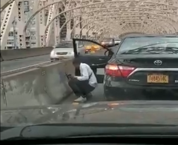 Questions of intent surround viral video of man painting over hate graffiti on Ed Koch-Queensboro Bridge 2