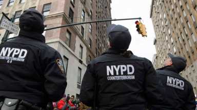 Members of the NYPD counterterrorism unit patrol the 2.5 mile route of the 90th annual Macy