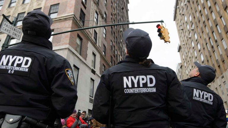 Members of the NYPD counterterrorism unit patrol the 2.5 mile route of the 90th annual Macy