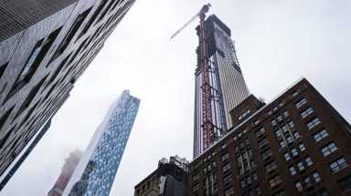 The Manhattan district attorney  charged executives from Parkside Construction and Affinity HR with wage theft and insurance fraud at construction sites such as 111 57th St., right, on Wednesday, May 16, 2018.