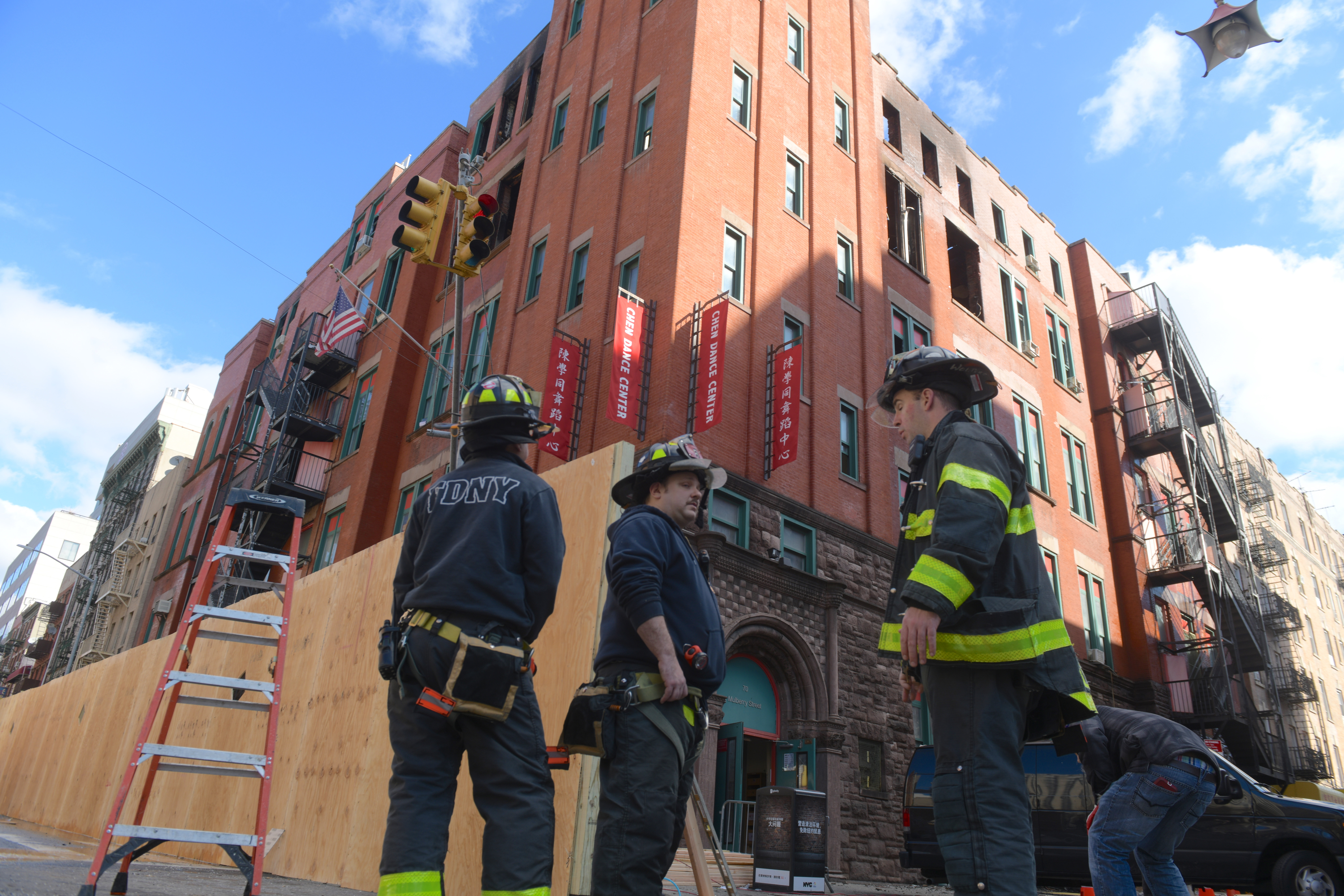 Firefighters continued to tour in the interior of the burnt out building that house a senior center, non-profits and the MOCA archives
