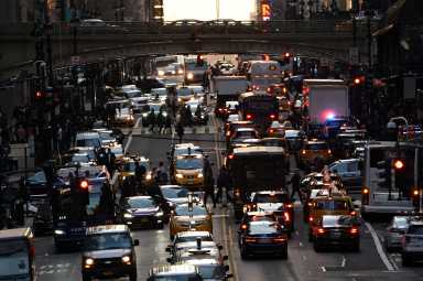 Traffic is pictured at twilight along 42nd St. in Manhattan