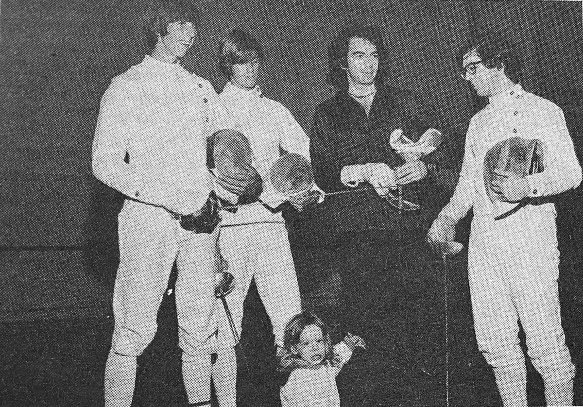 Neil Diamond with his 2-year-old son Jesse and NYU fencers, left to right: Mike Sheridan, Tom Sheridan and Ed DeViro