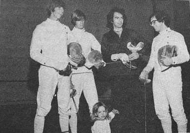 Neil Diamond with his 2-year-old son Jesse and NYU fencers, left to right: Mike Sheridan, Tom Sheridan and Ed DeViro