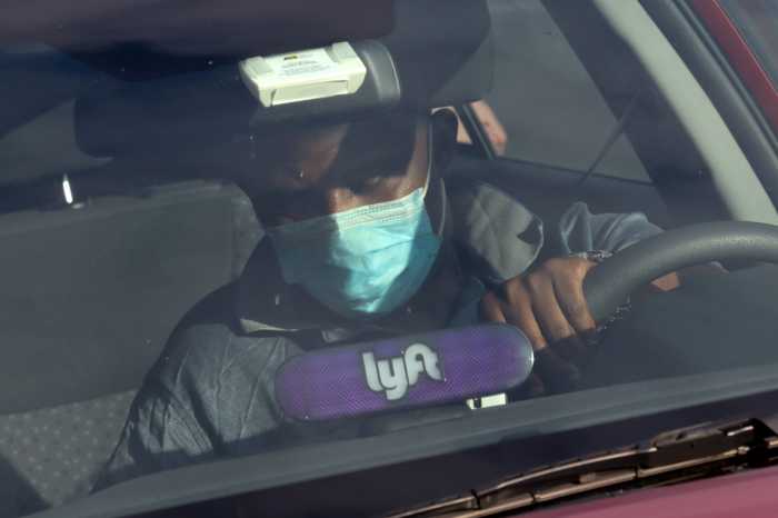 Lyft sees rider demand rebound in late April, 'on path to profitability' 5 A Lyft driver wears a mask during the coronavirus