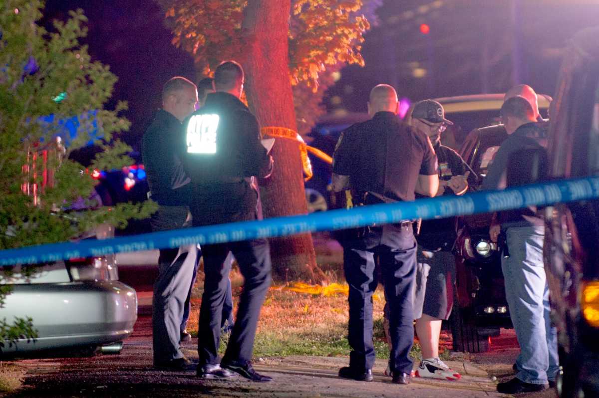 Cops and Detectives exchange information at the scene of a shooting at 246 Street and 137 Avenue in Rosedale, Queens. A man was removed in critical condition.