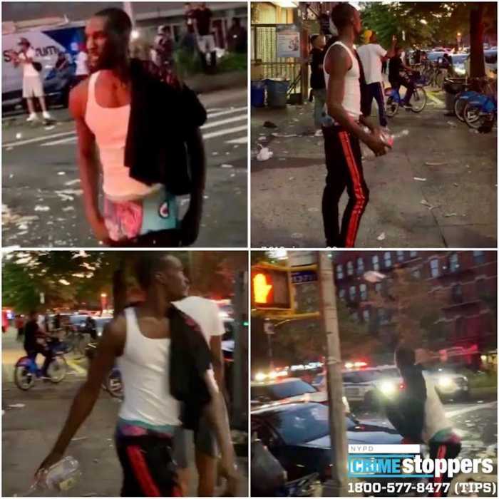 Man wanted for throwing liquor bottle at NYPD vehicles in Harlem 2
