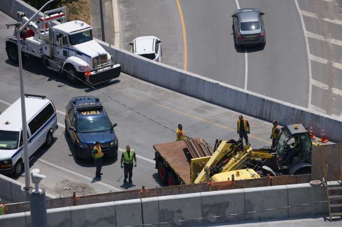 Two injured, traffic jammed in overturn truck with steel girders off RFK Bridge to Bronx 5
