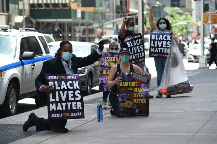 SEIU Building workers union take a knee at Manhattan buildings for Black Lives Matter movement 2