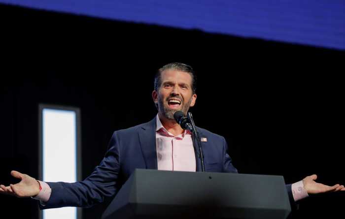 Donald Trump Jr. speaks to young people waiting to hear his father, U.S. President Donald Trump, deliver an "Address to Young Americans" at the Dream City Church in Phoenix, Arizona, U.S., June 23, 2020.
