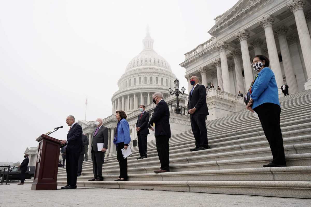 Activists rally in front of the Senate Dirksen Office Building to oppose Supreme Court nomination of Judge Amy Coney Barrett