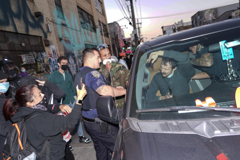 Protesters march from Brooklyn to Queens against police unions and QAnon 5