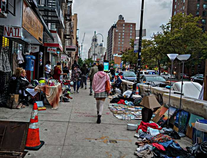 City agency claims outreach ongoing to vagrant vendors at East Village junk market 2 Passing through the junk market along East 14th Street and Avenue A.