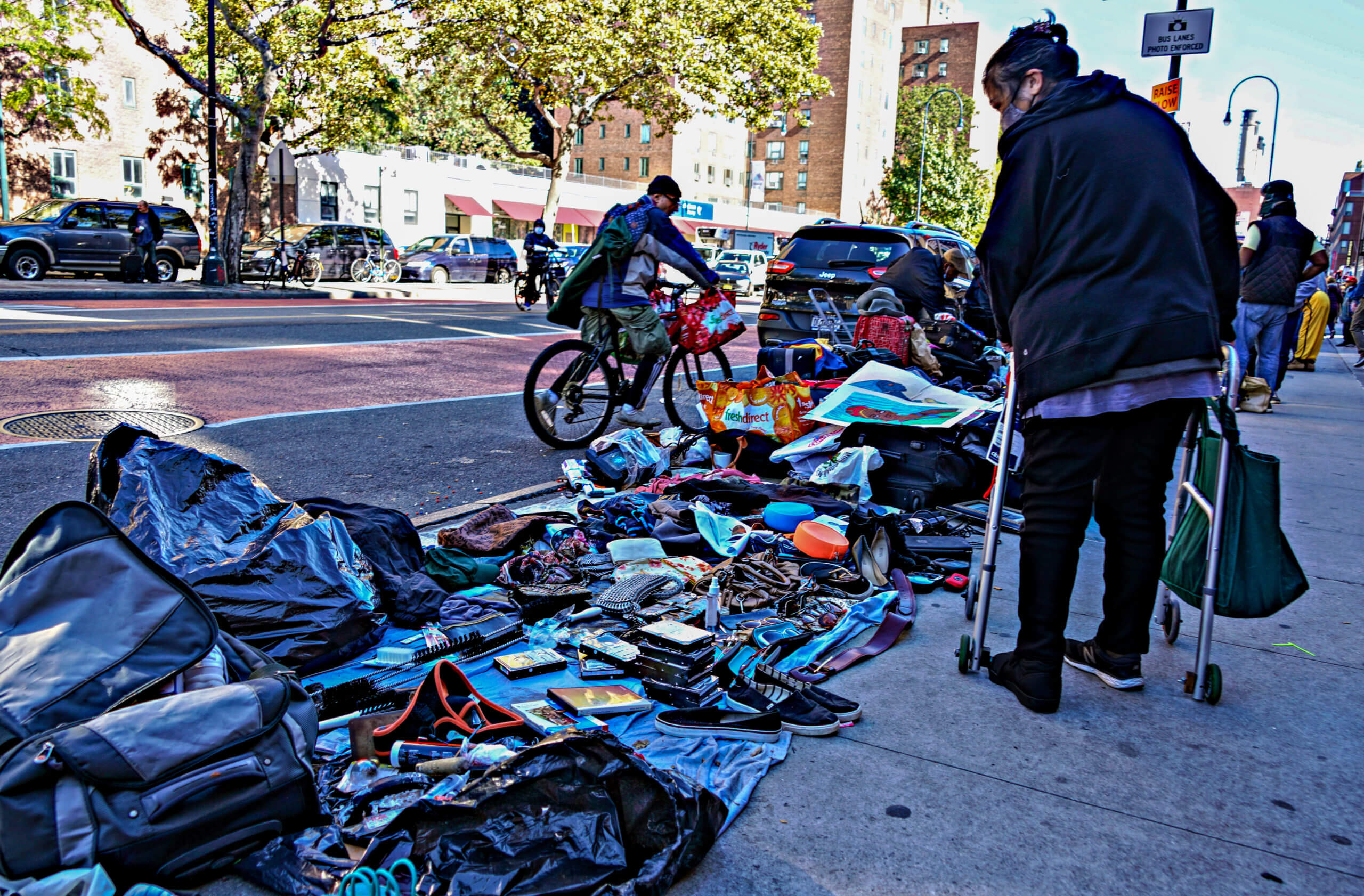 A bystander checks out merchandise along East 14th Street in the East Village.