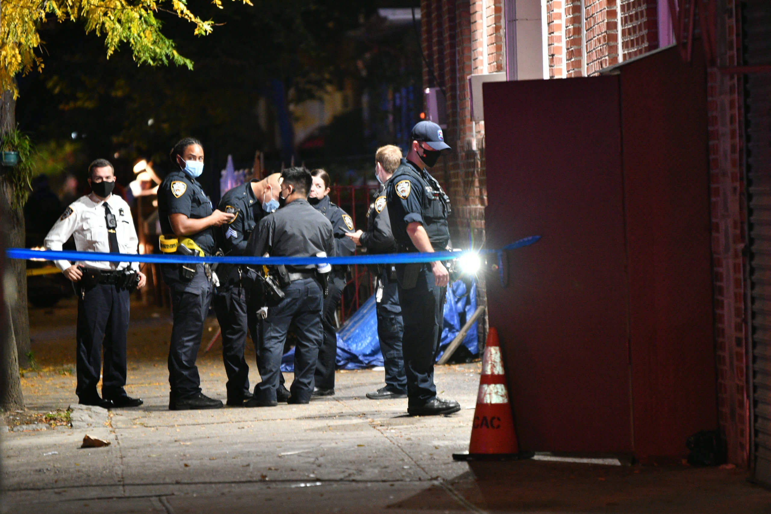 A drive by shooting left three males wounded at 397 East 49 Street