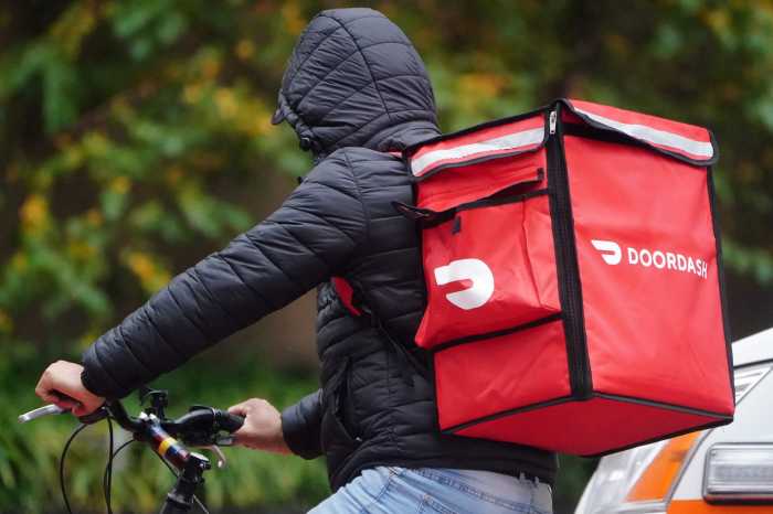 DoorDash aims to raise $3.14 billion in much-awaited IPO 10 A delivery person for Doordash rides his bike in the rain in the Manhattan borough of New York City, New York, U.S., November 13, 2020.