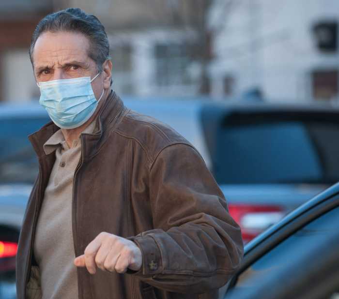 Cuomo unveils new COVID-19 vaccine hub program, lowers eligibility age, shuts press out again 3 Govenor Andrew Cuomo arrives at William Reid Houses for press conference on Jan. 23, 2021.