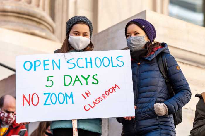 NYC public schools students, parents, and teachers rally on the steps of the Tweed Courthouse demanding the reopening of NYC public schools.
