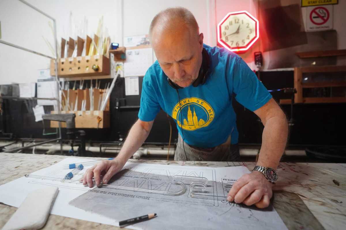 The lights are on: Lower Manhattan store keeps neon dream alive for 50 years 1 A worker makes a neon sign at the "Let There Be Neon" store in New York