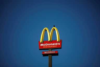FILE PHOTO: The McDonald’s company logo stands on a sign outside a restaurant in Bretigny-sur-Orge, near Paris