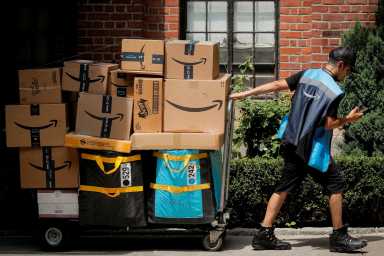 Amazon sees Prime Day sales boost amid supply chain snags 40 An Amazon delivery worker pulls a delivery cart full of packages during its annual Prime Day promotion in New York City, U.S., June 21, 2021.