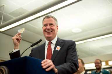 Mayor Bill de Blasio shows off an IDNYC card