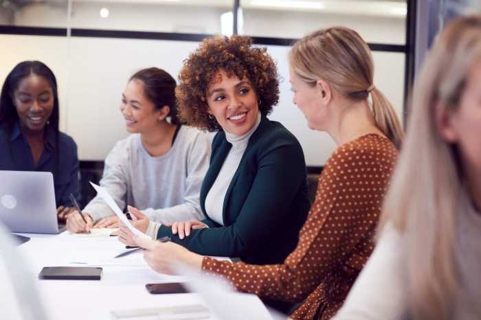Help your business grow by nominating it for a Top NYC Workplaces Award 2 Group Of Businesswomen Collaborating In Creative Meeting Around Table In Modern Office
