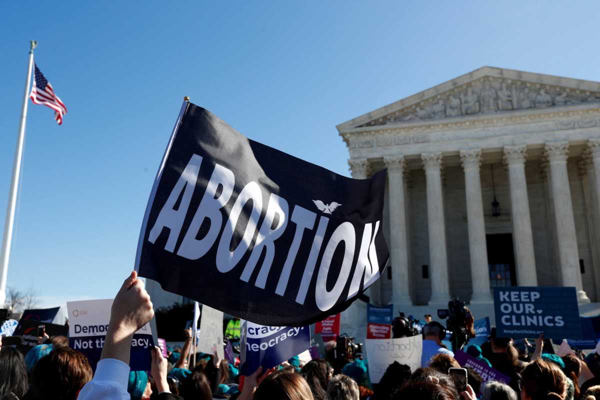FILE PHOTO: U.S. Supreme Court justices hear a major abortion case on the legality of a Republican-backed Louisiana law that imposes restrictions on abortion doctors, on Capitol Hill in Washington