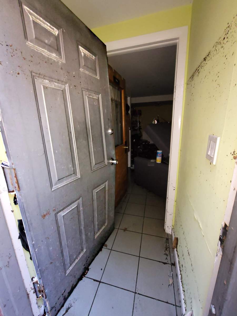 'It broke the door in!' Queens residents recount terrifying night of flooding 11 Kurani's door was warped from the flood