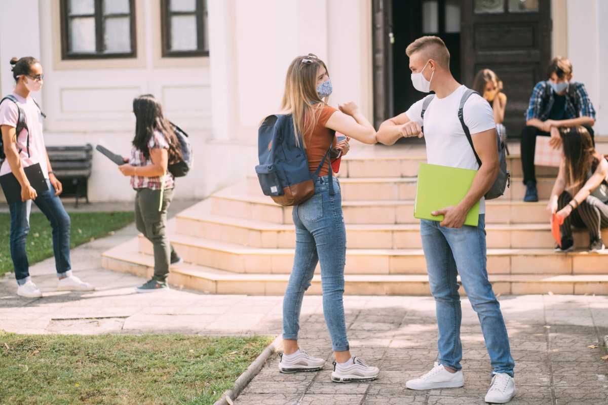 Alternative elbow bump greeting during coronavirus epidemic.