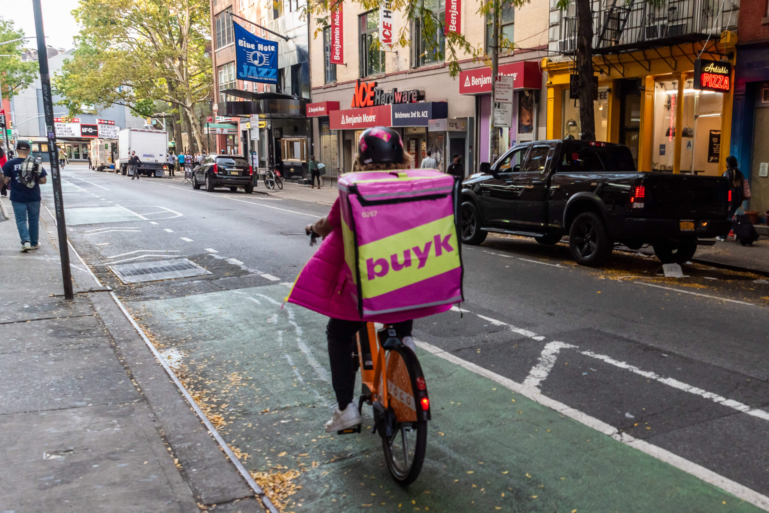Supermarket struggle: Why are New Yorkers losing their beloved grocery stores? 13 grocery delivery person on a bike