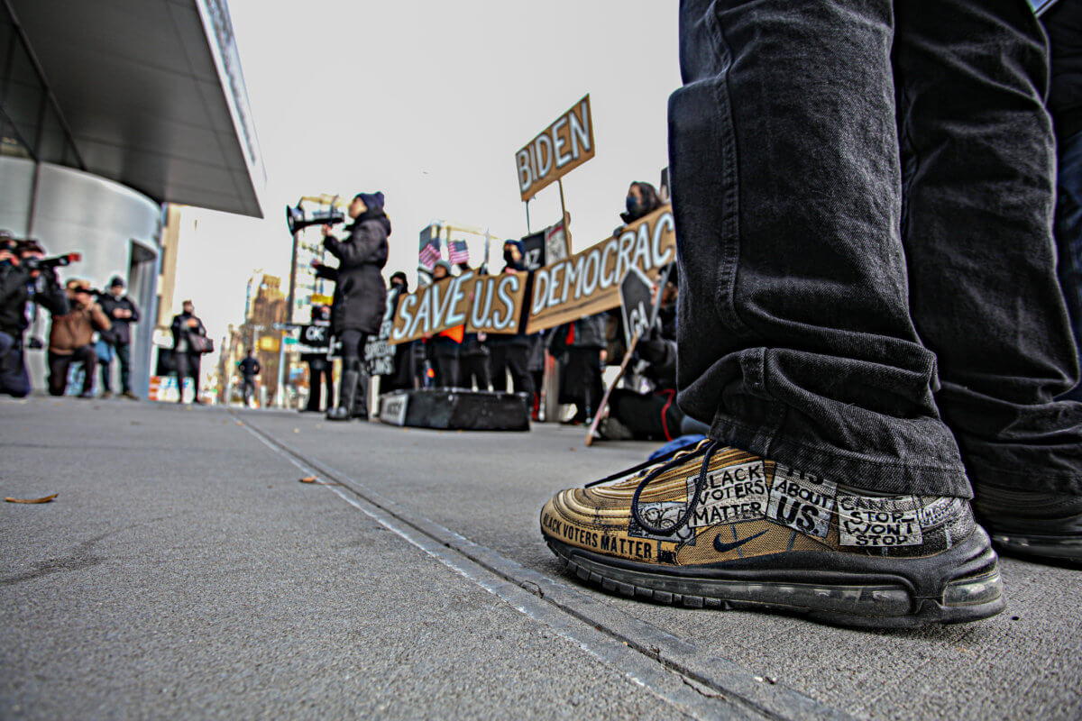 'Everybody thinks it can't happen here until it does': Protesters outside UN hold fake funeral for democracy, voting rights in America 7
