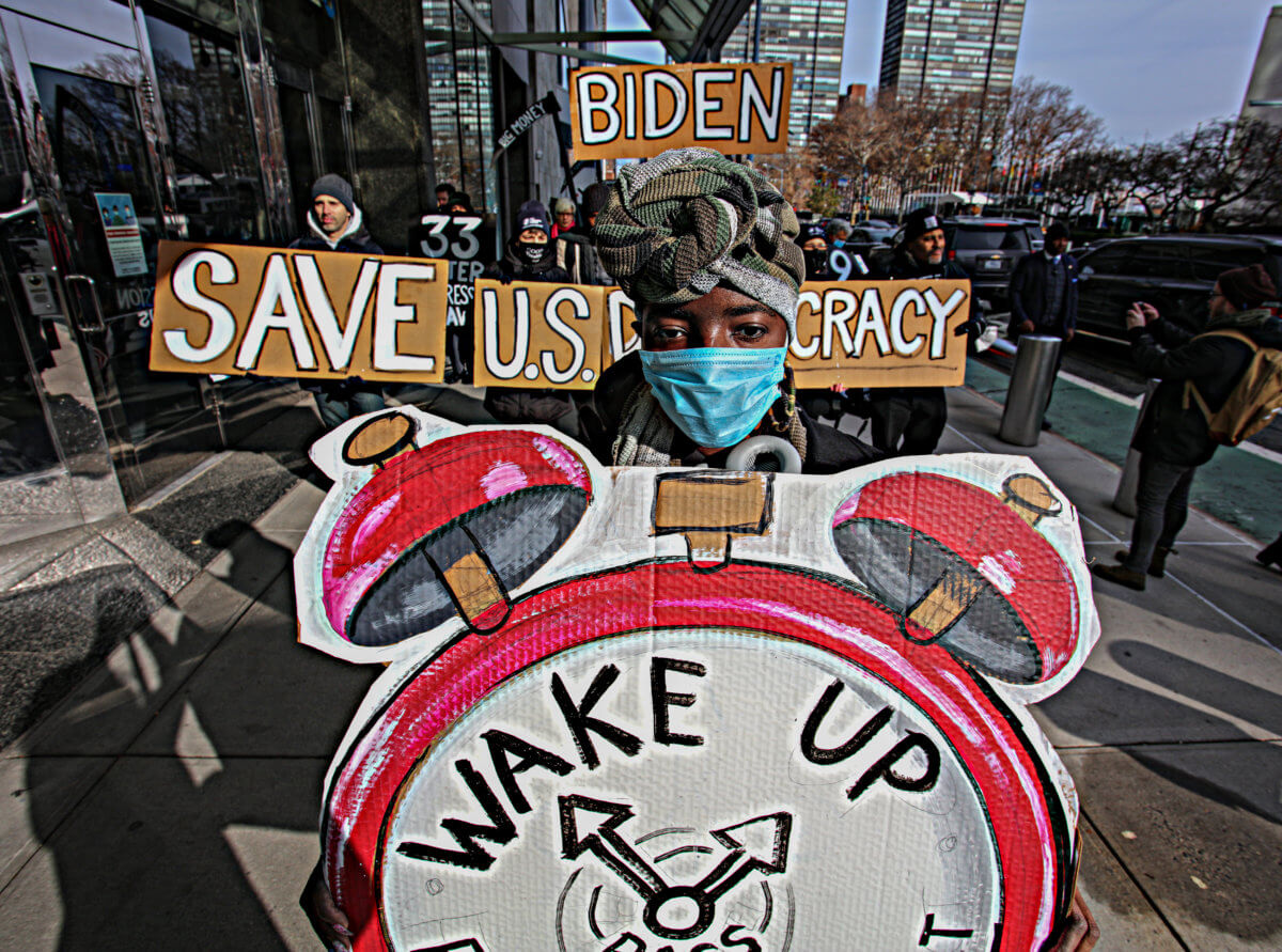 'Everybody thinks it can't happen here until it does': Protesters outside UN hold fake funeral for democracy, voting rights in America 9