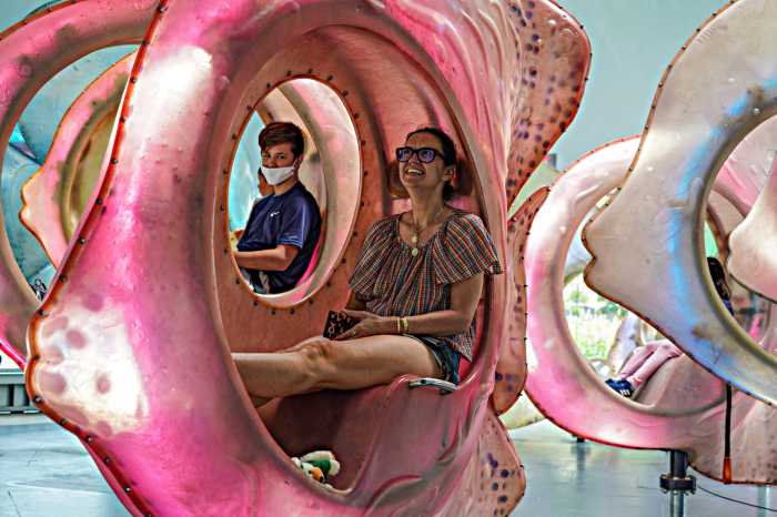 A family rides gigantic fish at the Seaglass in Battery Park on July 8.