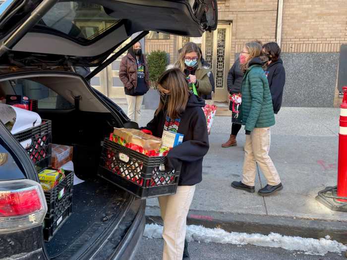 Students at Catholic academy in Brooklyn contribute to a school food drive ahead of Martin Luther King Jr. Day 2