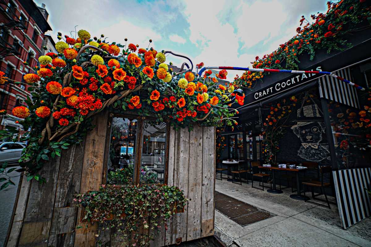 A flower-draped outdoor dining shed at French bistro Loulou.