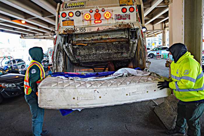 Cops, sanitation clear homeless encampment under BQE as Adams' new policy takes effect 6 DSNY clear homeless encampment