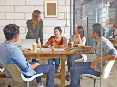 team of young entrepreneurs meeting in office