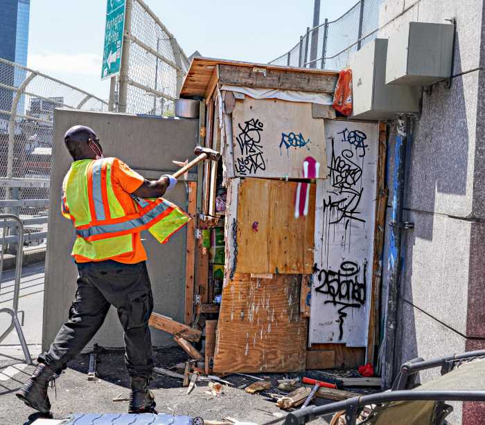 Smashed on the span: Homeless man's Manhattan Bridge hut torn down by city workers 11