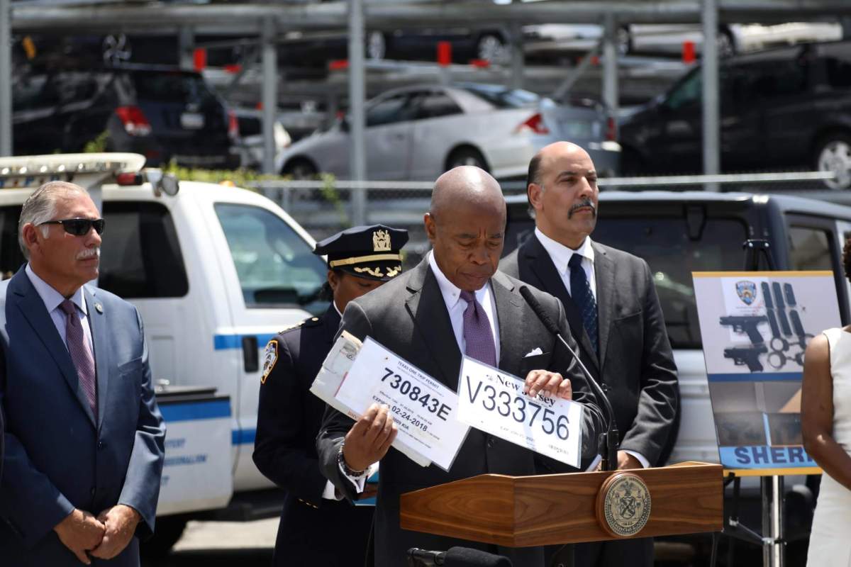 Fake it and they'll take it! Mayor Adams, NYPD launch another crackdown on counterfeit license plates 3 Mayor Eric Adams holds a couple of phony license plates at a briefing in Queens