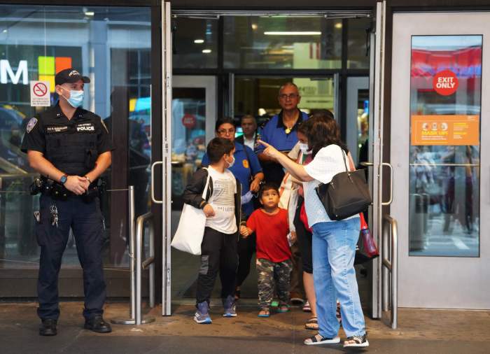 A family leaves Port Authority Bus Terminal