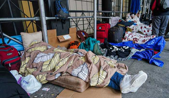 Op-ed | Lift up New Yorkers in need -- no matter when they arrived here 18 Asylum seekers sleep outside of the Watson Hotel