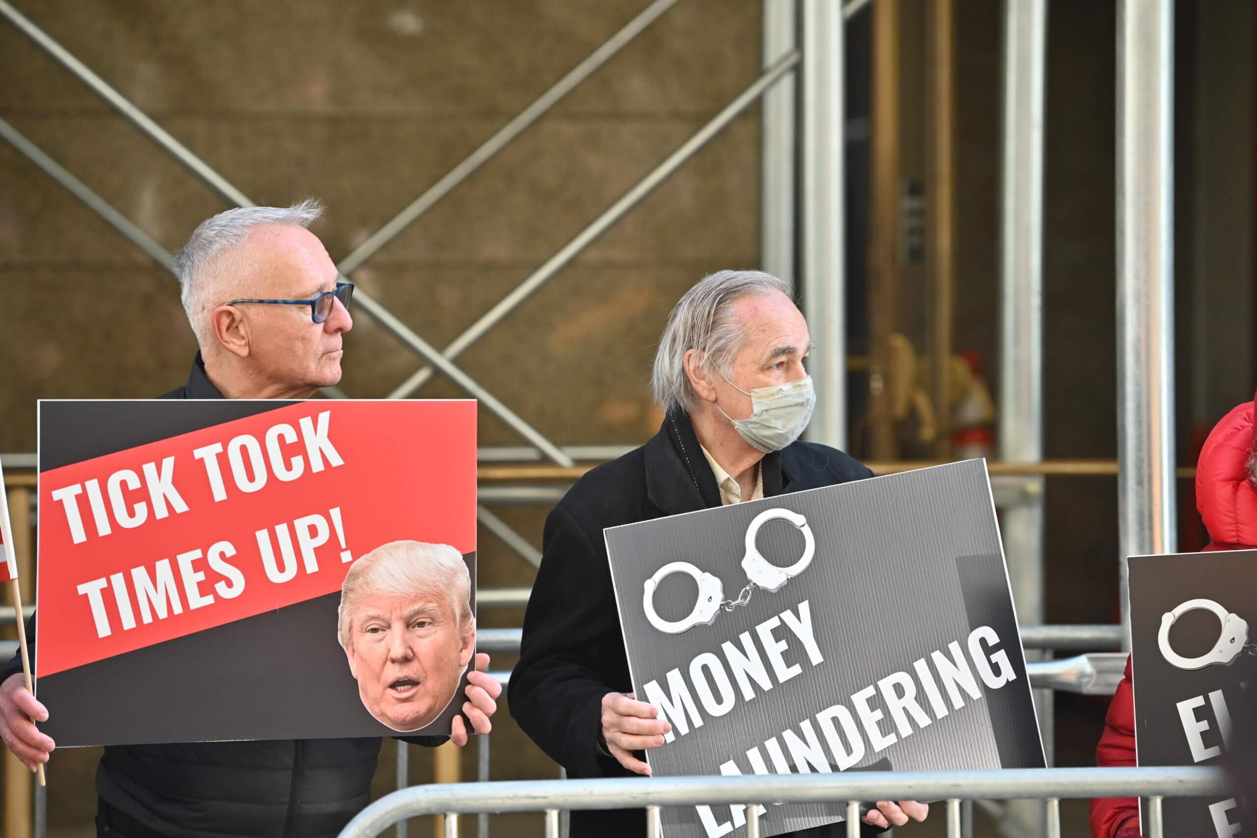 Make America gripe again: Few Trump supporters answer their leader's protest calls as criminal indictment looms 23 People Holding Cards in Protest Against Trump