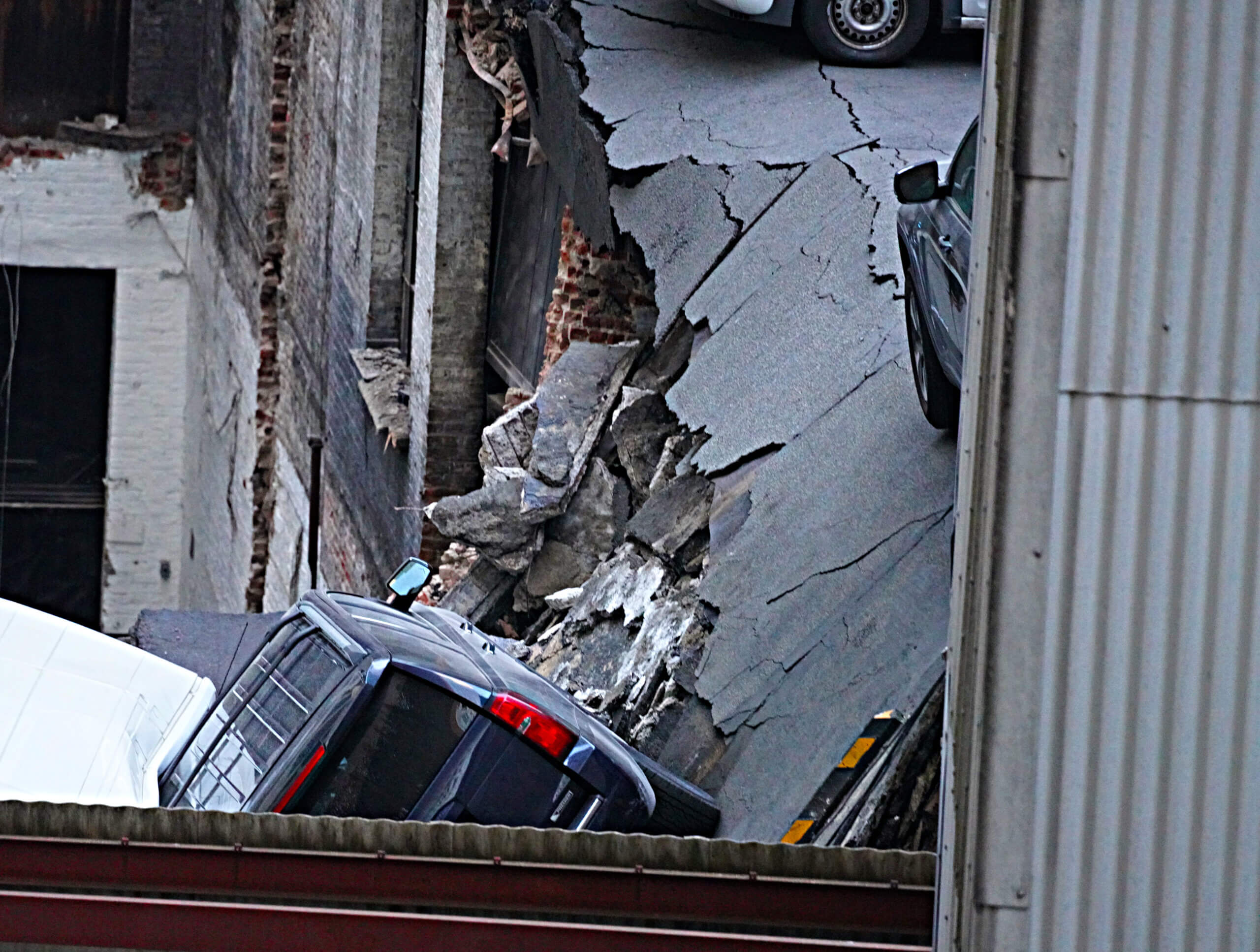 Parking garage collapse: Investigation continues at Lower Manhattan site where open building code violations had existed 12 Roof of parking garage collapsed in Lower Manhattan.