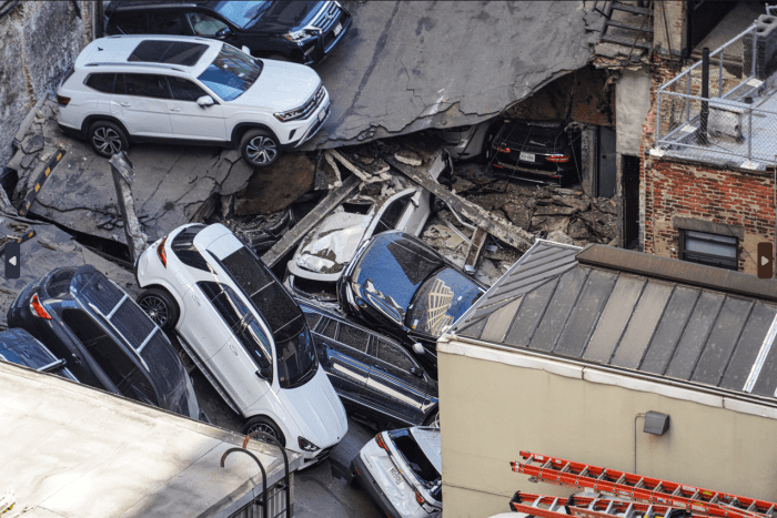 Parking garage collapse: Investigation continues at Lower Manhattan site where open building code violations had existed 11 The roadbed on the garage's roof caved in